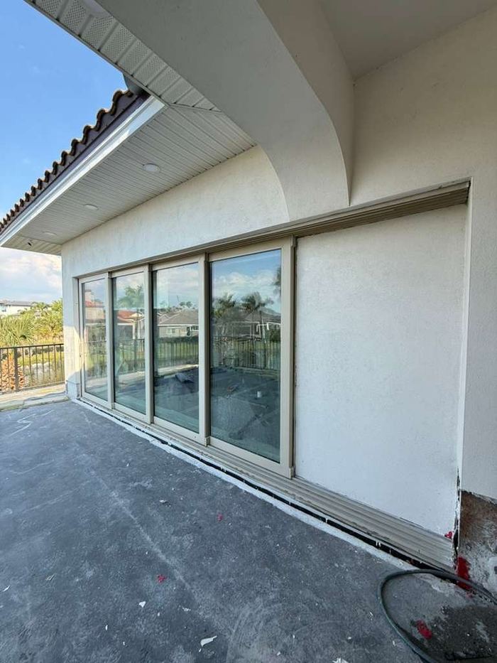 Finished multi-panel sliding glass door after glass replacement in Tampa